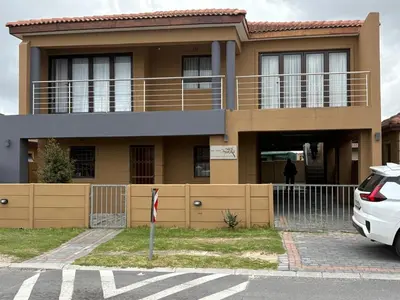 a house with a car parked in front of it at SNE Travellers in Faure