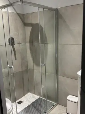 a shower with a glass door in a bathroom at Alicante in Worcester