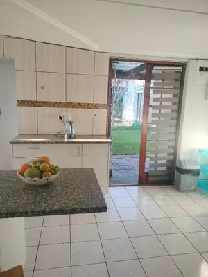 a kitchen with a bowl of fruit on a counter at Near Grandwest in Thornton
