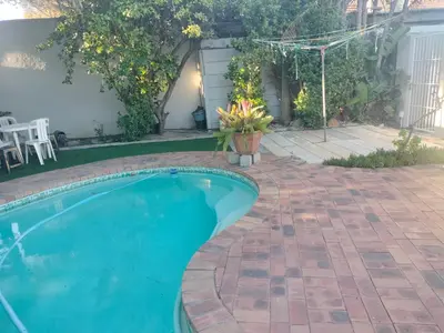 a swimming pool in a yard with a patio at Near Grandwest in Thornton