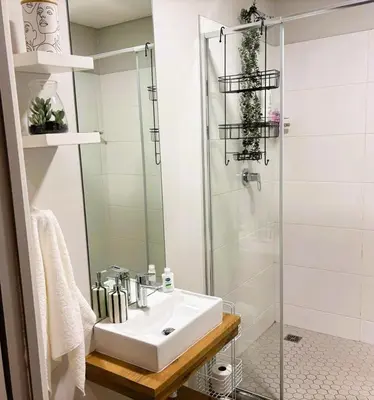 a bathroom with a sink and a shower at Bachelors Unit at The Den in Stellenbosch