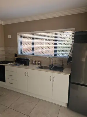 a kitchen with a sink and a window at Cape Town Glam in Welgemoed
