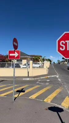 a stop sign on the side of a street at Home of peace self catering accommodation