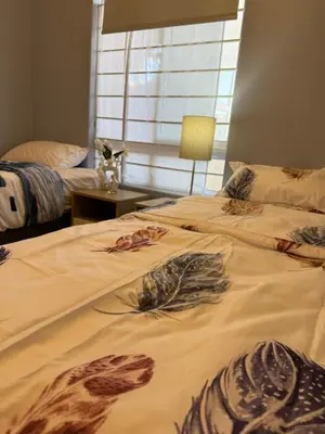a bedroom with two beds with fish drawings on them at Cozy Apartment with Table Mountain and beach views in Cape Town