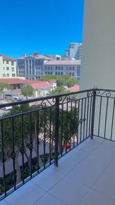 a balcony with a view of a city at De Groove Luxury Homes in Cape Town