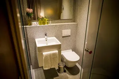 a small bathroom with a sink and a toilet at Nicara to Akker Collective in Stellenbosch