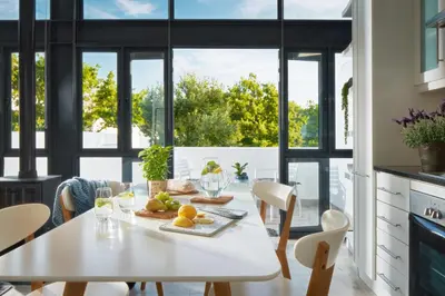 a kitchen with a white table with fruit on it at 22 Eikehoff Apartment in Stellenbosch