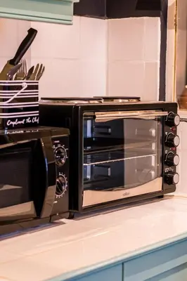 a microwave oven sitting on top of a kitchen counter at Skyview Manor in Stellenbosch