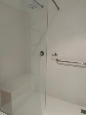 a shower with a glass door in a bathroom at Hermanus Heights Villa in Hermanus