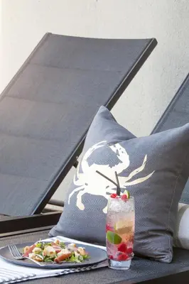a drink on a table with a plate of food at Bliss Boutique Hotel in Cape Town
