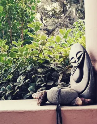 a statue of a ghost sitting on a window sill at Frieden-Hof Guest Accommodation in Penhill