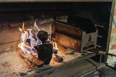 a fire in a stove with a box on it at Marshden Estate in Stellenbosch
