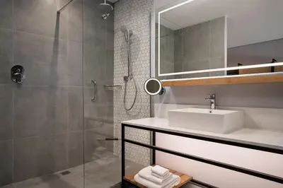 a bathroom with a sink and a shower at Cape Town Marriott Hotel Crystal Towers in Cape Town