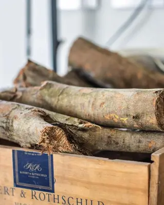a wooden box filled with different types of logs at Le Grenier Luxury Loft in Franschhoek