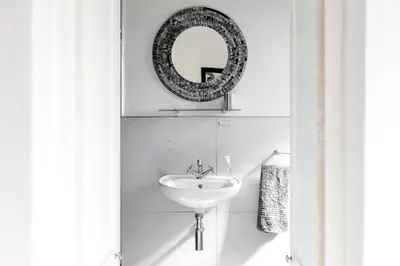 a bathroom with a sink and a mirror at Bona Vista Self-Catering Accommodation in Klapmuts