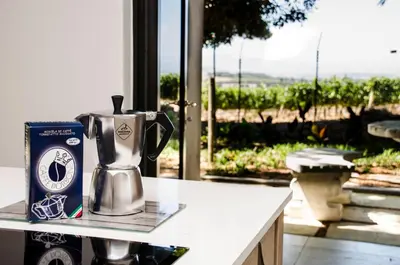 a coffee pot sitting on a counter with a box on it at Lavinia Lifestyle in Stellenbosch
