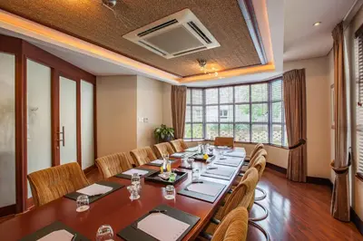 a conference room with a long table and chairs at City Lodge Hotel Pinelands in Cape Town
