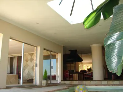 a house with a swimming pool and a skylight at Shirleys Place in Brackenfell