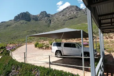 a white truck parked under a white umbrella at Big Sky Cottages in Wolseley
