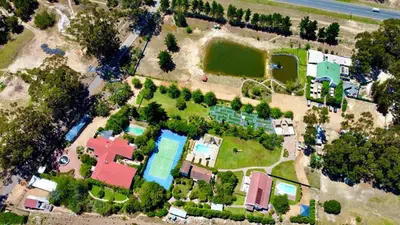 an aerial view of a house with a pool at Vine Guesthouse in Stellenbosch