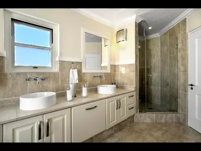 a bathroom with two sinks and a shower at 10 Villefranche in Franschhoek