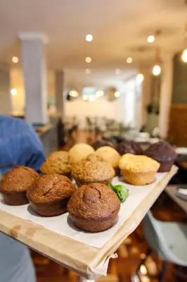 a tray of muffins sitting on top of a table at New National Hotel and Conference in Parow