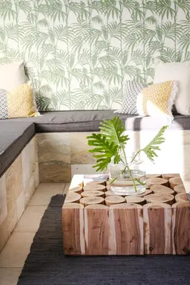 a coffee table with a plant on top of it at New National Hotel and Conference in Parow