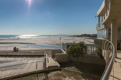 a house with a view of the beach at Lagoon Beach 136A by CTHA in Cape Town
