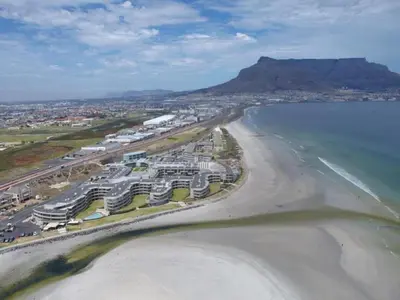 an aerial view of a beach with condos and the ocean at Lagoon Beach 136A by CTHA in Cape Town