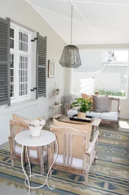 a living room with a table and chairs and a couch at Madeliefie Guest Accommodation in Paarl