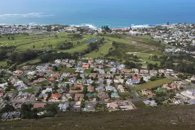 an aerial view of a town on a hill at Seaside Hermanus Guest Room in Hermanus