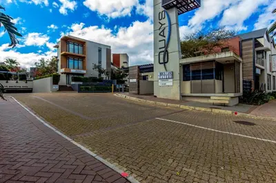 an empty street in front of a building at Quayside 301 by CTHA in Cape Town