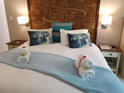 two stuffed animals sitting on top of a bed at Dilisca Guesthouse in Durbanville