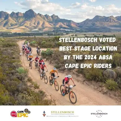 a group of people riding bikes down a dirt road at Anesta House in Stellenbosch