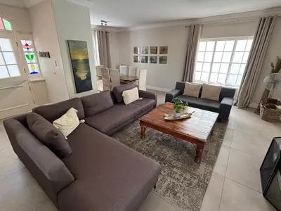 a living room with a couch and a coffee table at Anesta House in Stellenbosch