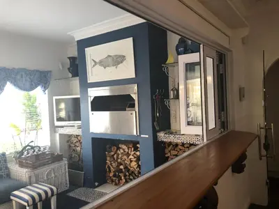 a room with blue walls and a stairway at Our Hermanus House in Hermanus