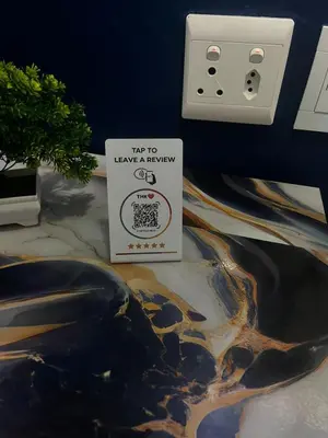 a sign sitting on a table next to a lightswitch at Mitchell's Guesthouse in Parow