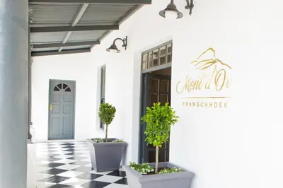 a store front with a black and white checkered floor at Mont d'Or Franschhoek in Franschhoek