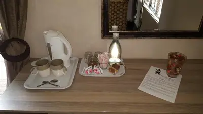 a table with a toilet and items on it at Guest House Frame Ace in Bellville