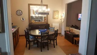 a kitchen and dining room with a table and chairs at Guest House Frame Ace in Bellville