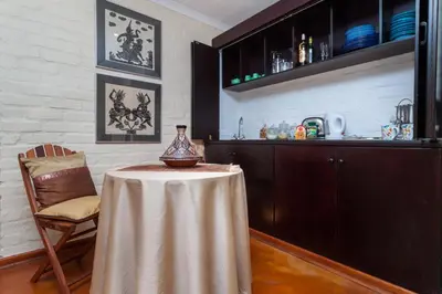a table with a vase on it in a kitchen at The Garden View Suite in Franschhoek