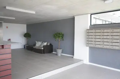 a living room with a couch and a table at Key West 417 by CTHA in Cape Town