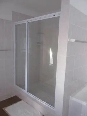 a shower with a glass door in a bathroom at Casa Del Mar in Hermanus