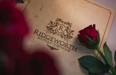 a woman with a flower on her back at Ridgeworth Boutique Guesthouse in Bellville