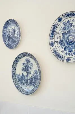 three blue and white plates hanging on a wall at BlackHorse Accommodation in Stellenbosch