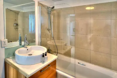 a bathroom with a sink and a shower at Horizon Bay 1404 by HMH in Bloubergstrand