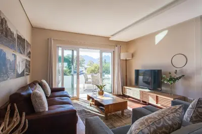 a living room with a couch and a tv at 109 on Dorp in Stellenbosch