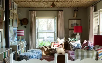 a living room with a couch and a window at Vredenhof Farm Cottage in Elgin