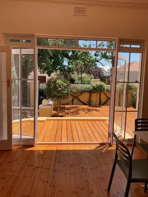 an open room with a deck with sliding glass doors at De Haas Luxury Living at Villa Grande in Stellenbosch