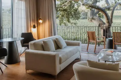 a living room with a couch and a table at Laborie Estate in Paarl